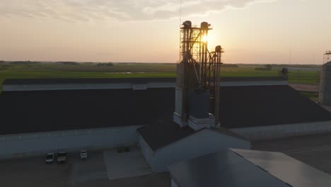 fertilizer bucket elevator silhouetted near brownstone, minnesota, usa. - aerial shot