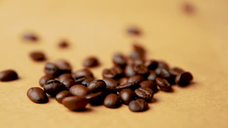 coffee beans fall on a coffee pile slow motion vintage look