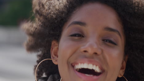 Portrait-happy-african-american-woman-smiling-in-urban-scene