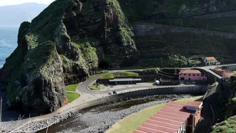 panoramic view of the roads and serpentine of madeira in a valley surrounded by mountains