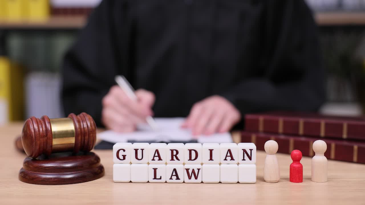 Guardian Law Concept with Judge, Gavel, and Wooden Figures