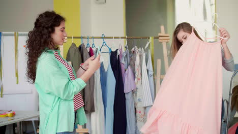 Dressmaker-taking-photo-of-client.