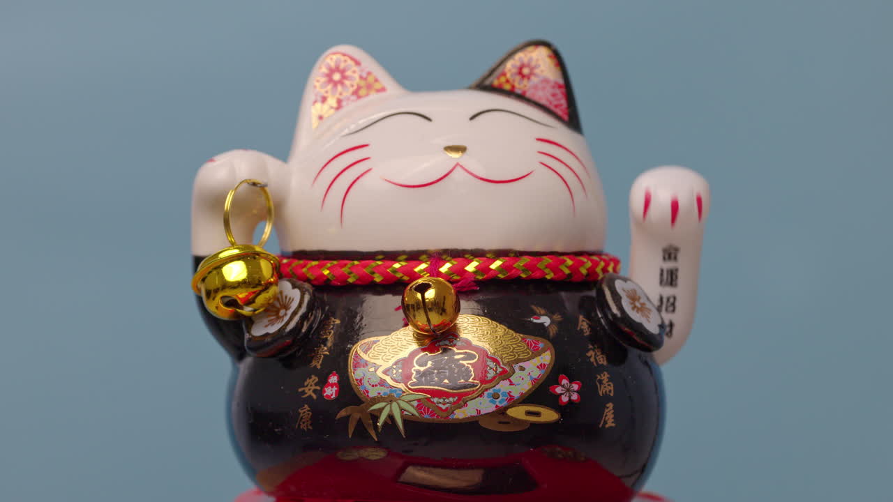 el gato de la suerte manejo agita