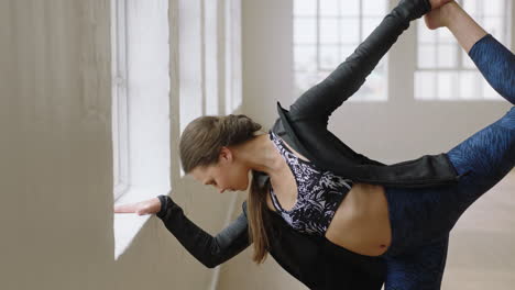 beautiful yoga woman stretching flexible body preparing for workout in fitness studio enjoying healthy lifestyle