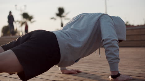 man doing push-ups outdoors