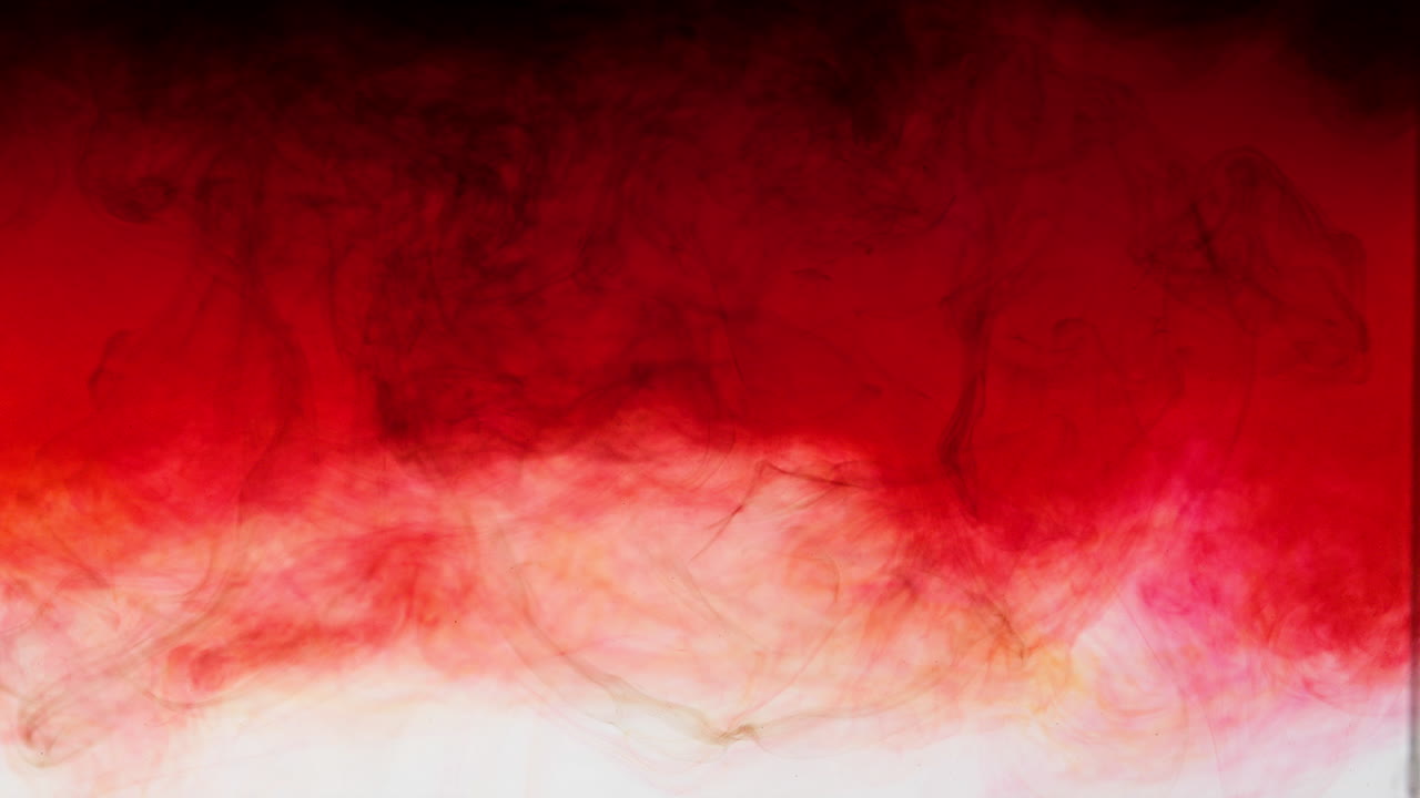 Dark red ink disperses to light gradient to white on abstract background