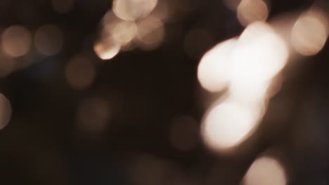 video of flickering yellow bokeh spots of light with copy space