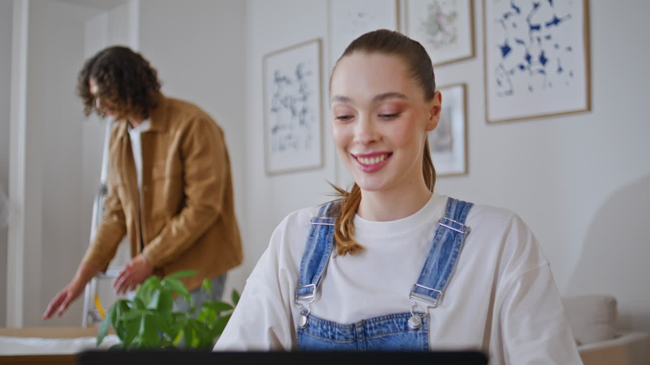Happy woman interacting laptop in cozy living room closeup. Smiling wife
