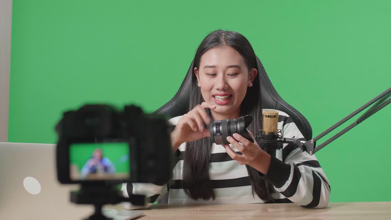 Woman Reviewing Camera Lens