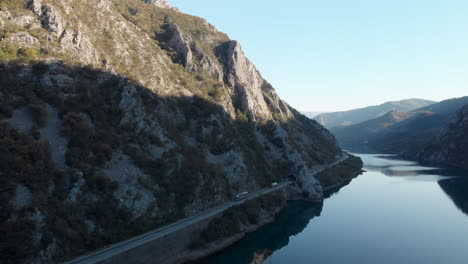 scenic road beside river neretva in bosnia mountainous countryside, aerial