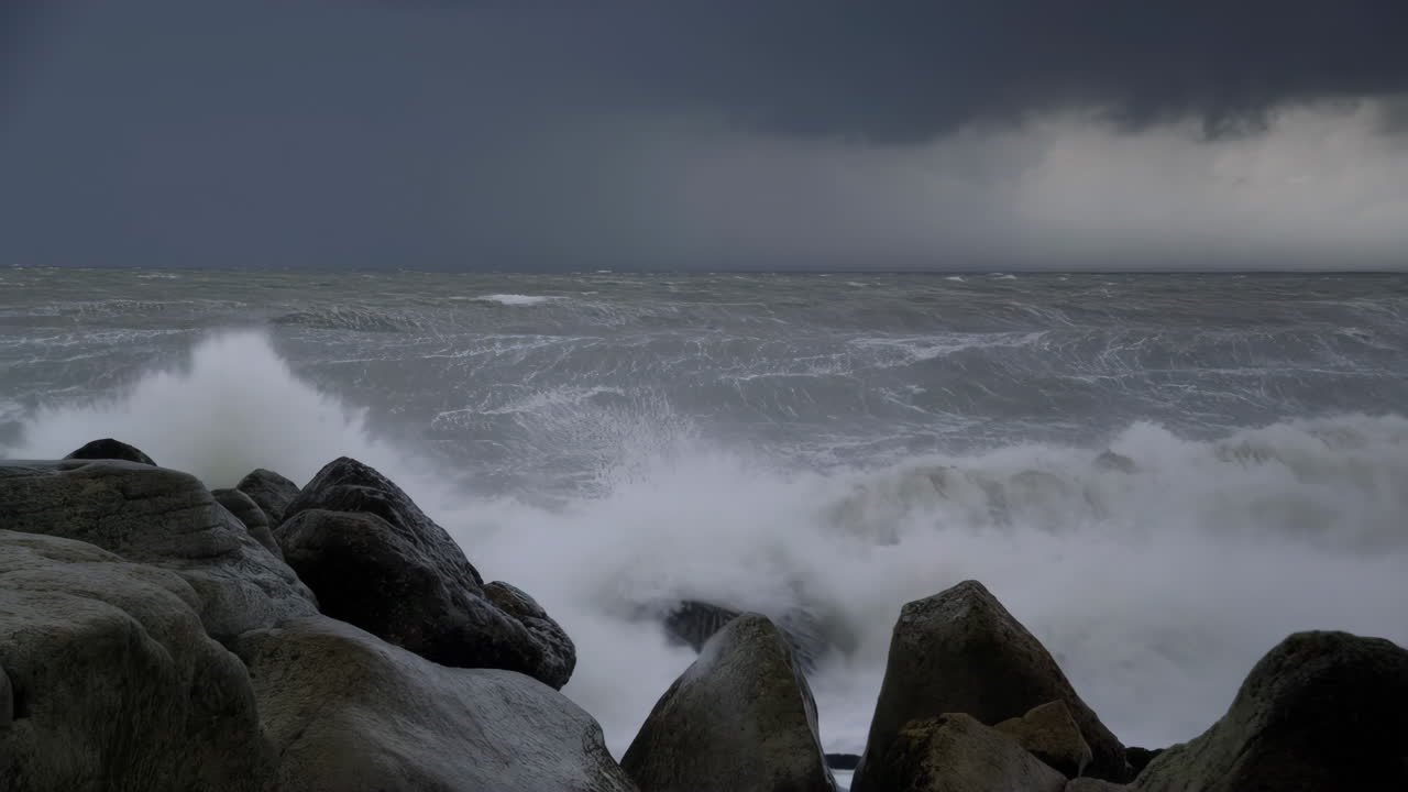 Powerful Waves Crashing on Rocky Shore During a Storm