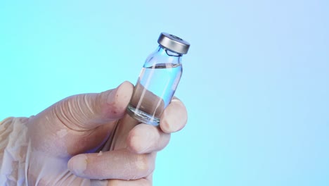 doctor holding a vaccine vial