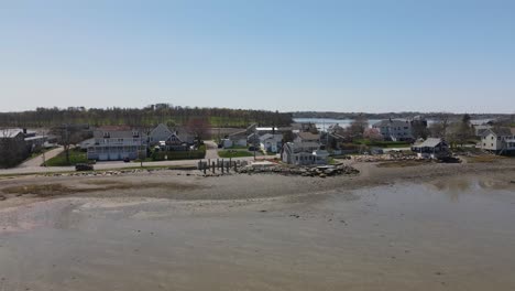 drone retreat from the shoreline revealing a neighborhood in hull