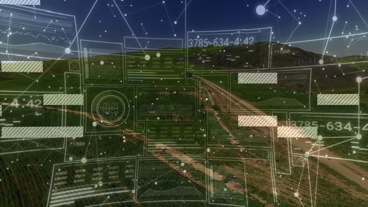 Digital interface animation over aerial view of rural landscape and fields