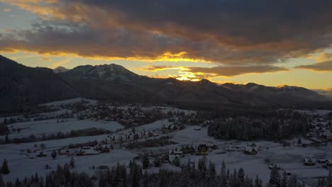 Panoramic-View-Over-Tatra-Mountains-And-Town-During-Sunset-Of-Winter---drone-shot