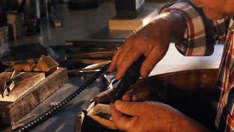 goldsmith using hand piece machine