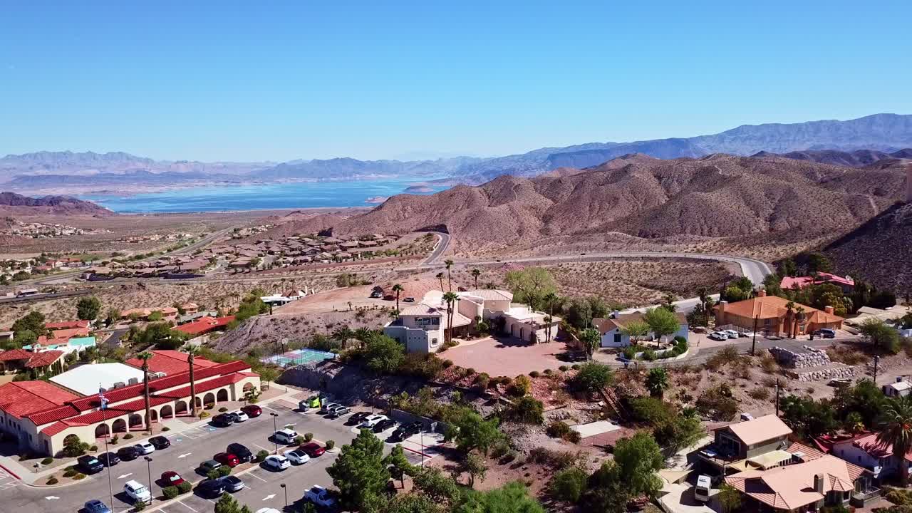 Drone going up higher Boulder City Nevada revealing Lake Mead in the background