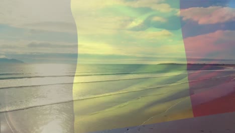 Digital-composition-of-belgium-flag-waving-against-aerial-view-of-waves-in-the-sea