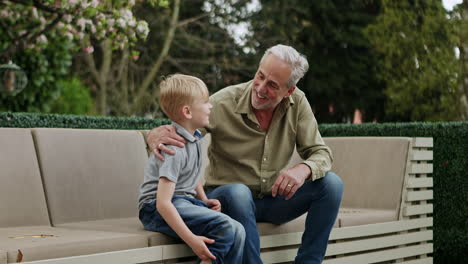 grandfather and grandson bonding in the garden