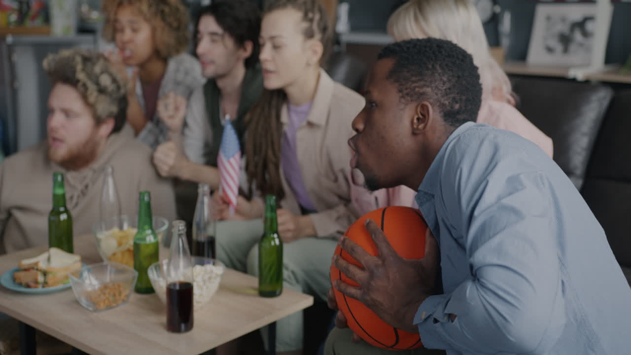 Friends Watching a Basketball Game