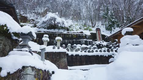 Yamadera-Temple-in-Winter,-Snowflakes-Falling-over-Mountain-in-Japan