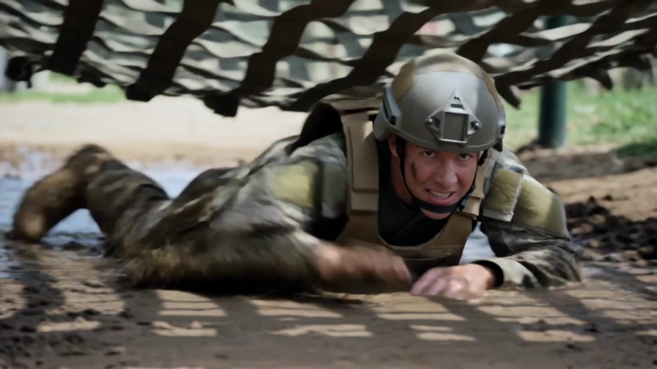 Entering tunnel soldier crawling using arms across mud trench under net in helmet vest for drill
