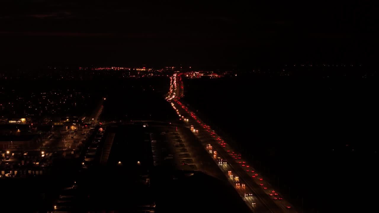 Congested traffic on a general road in Kaunas city. Aerial view at night