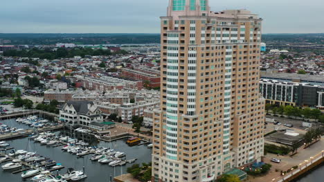 aerial tracking shot of the riverside and the harborview towers in baltimore