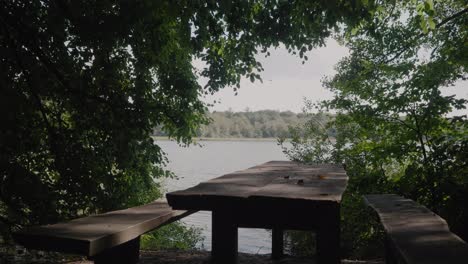 Empty-Bench-By-Gyllebo-Lake-In-The-Summer,-South-Sweden-Skåne,-Static-Medium-Shot