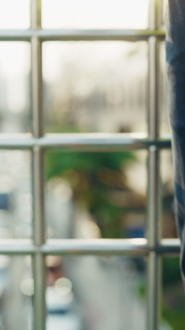 Hand holding a white hard hat