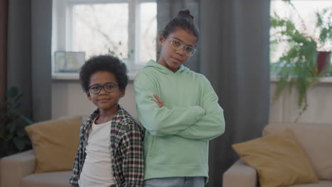 portrait of afro siblings in glasses