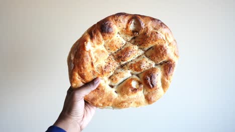 hand holding a turkish pide