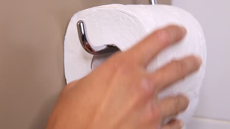 changing a fresh toilet paper roll