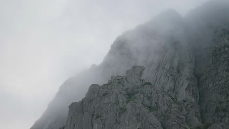 Huge-granite-walls-with-clouds-passing-by