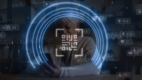 animation of qr code over woman using smartphone