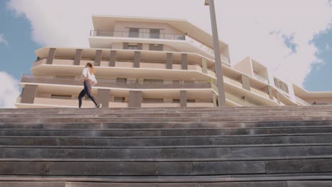 Wide-shot-of-runner-athlete-running-on-stairs