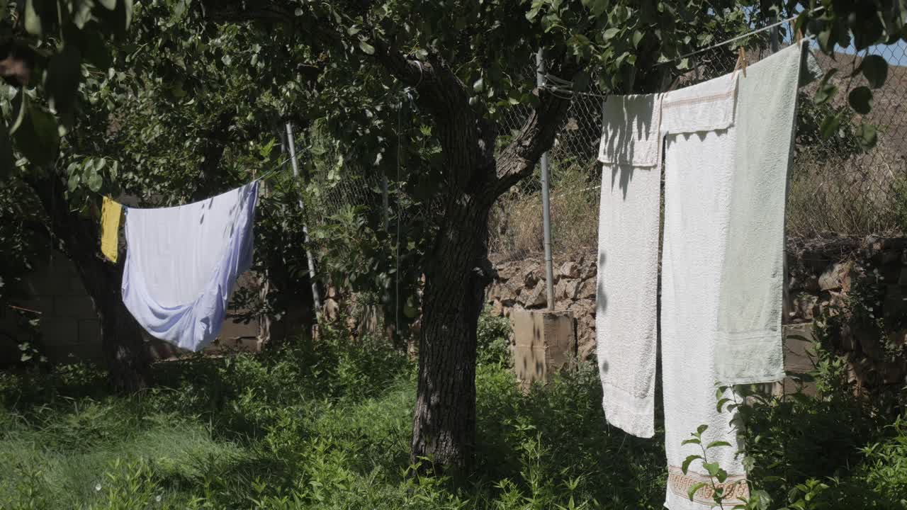 Clothes drying on a line outdoors, evoking calm and fresh nature vibes
