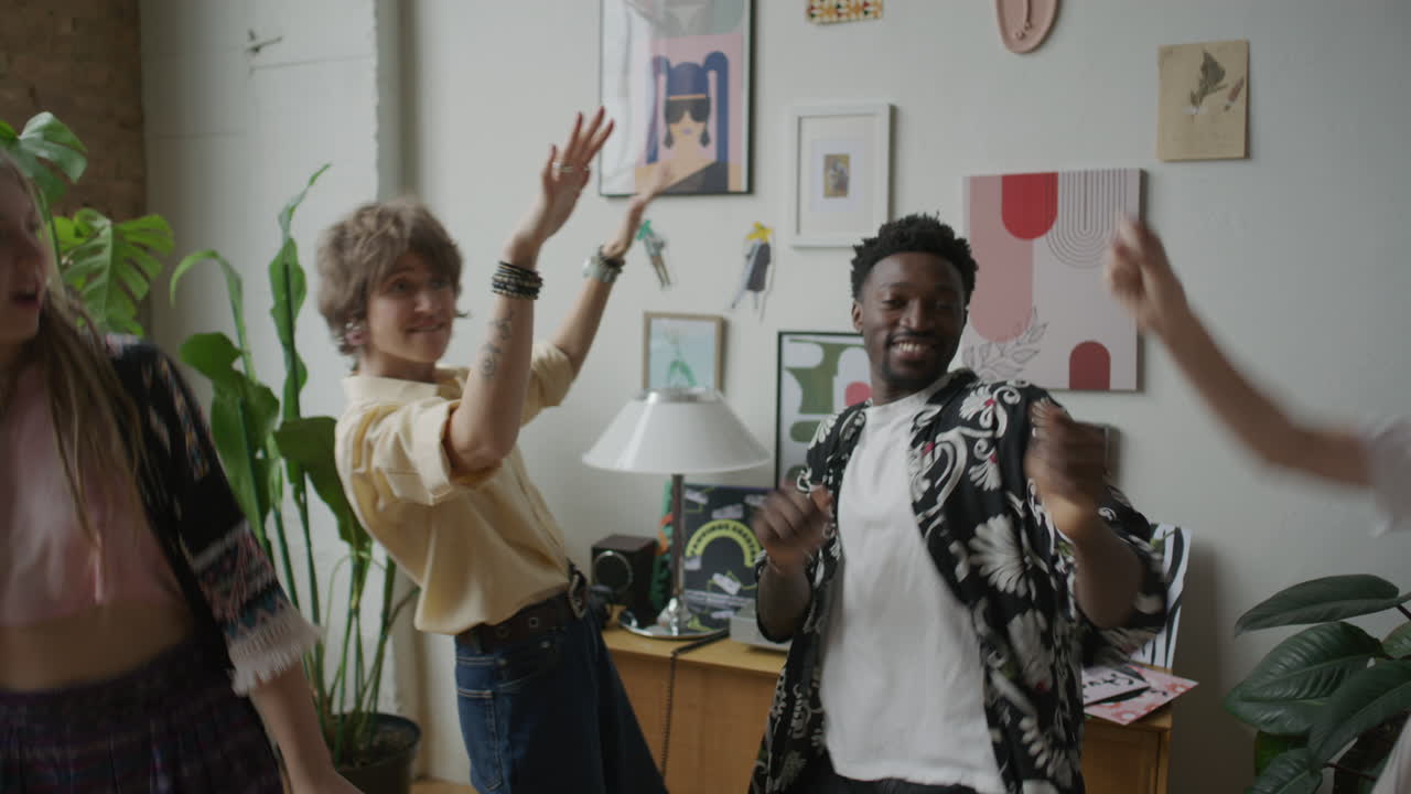 Group of Happy Friends Dancing and Enjoying Vinyl Music at Home Party