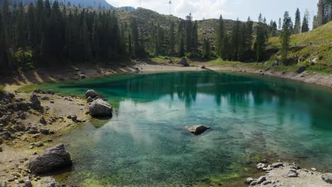 take off from lake carezza, in the beautiful dolomites