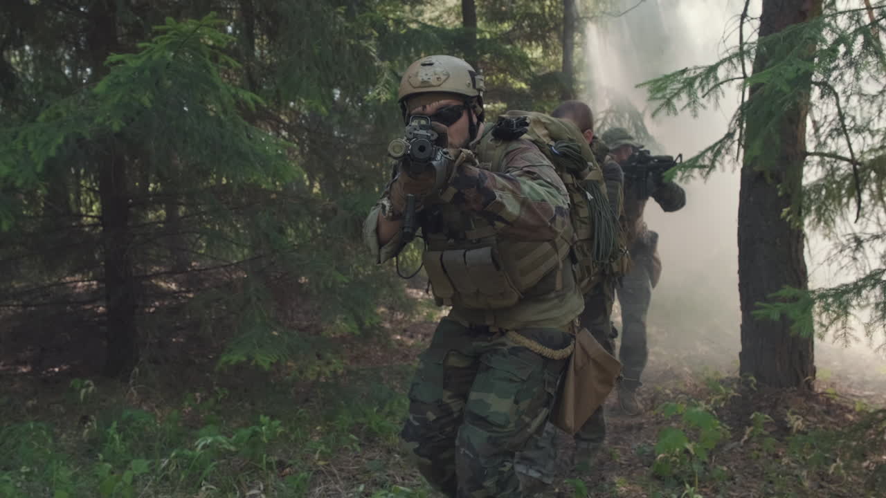 Soldiers Walking Through Smoke In Forest