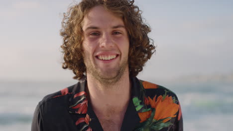 portrait of handsome young man laughing enjoying successful vacation travel lifestyle on sunny beach wearing hawaiian shirt