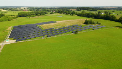 eco-friendly solar panels farm on vast grass field at summer near zielenica, northern poland