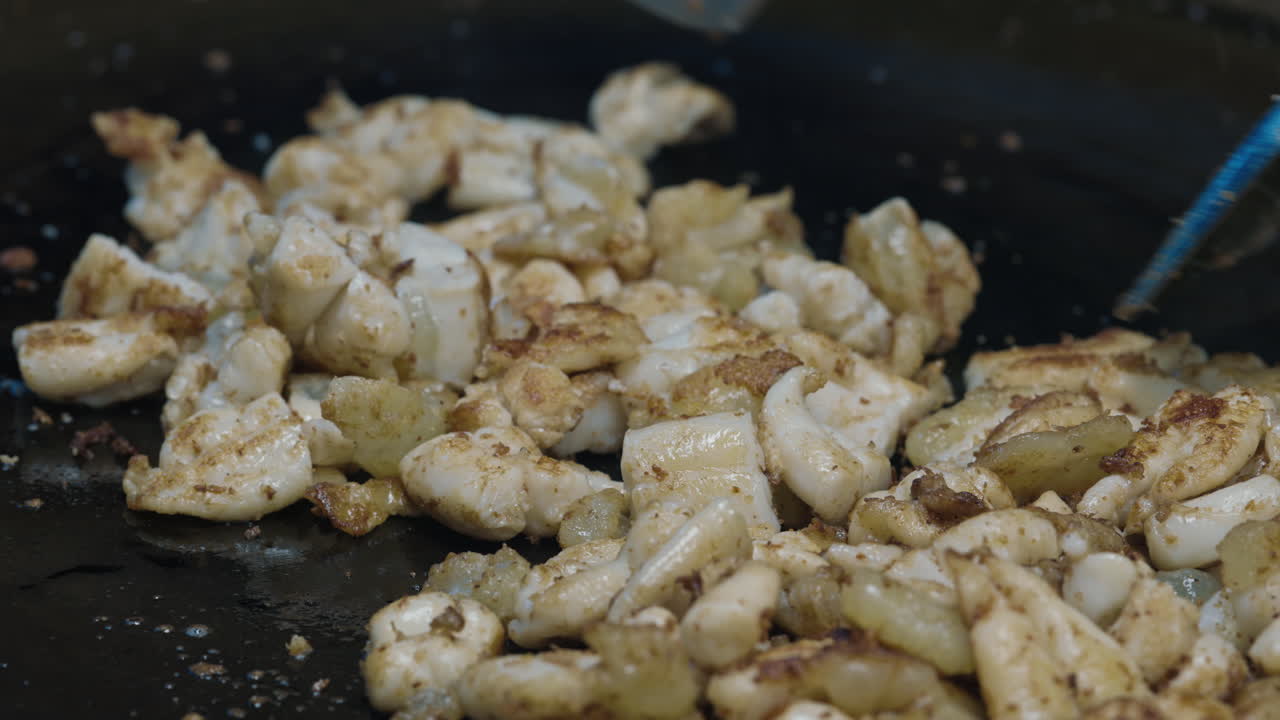 Cooking Fried Squid on a Hot Plate