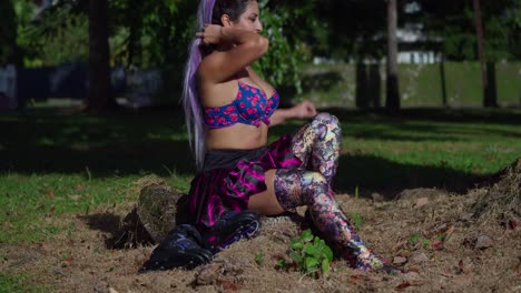 young gir in a sexy outfits with roller skates laying next to her at a park