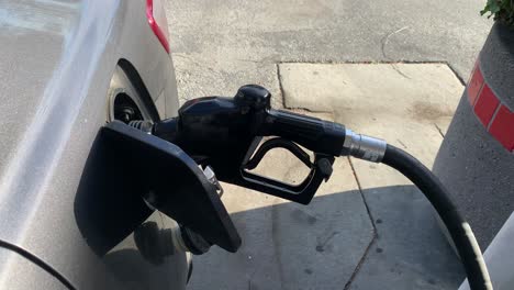 fueling a vehicle at gas station