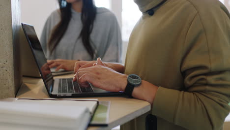 Hands-typing-on-laptop-keyboard