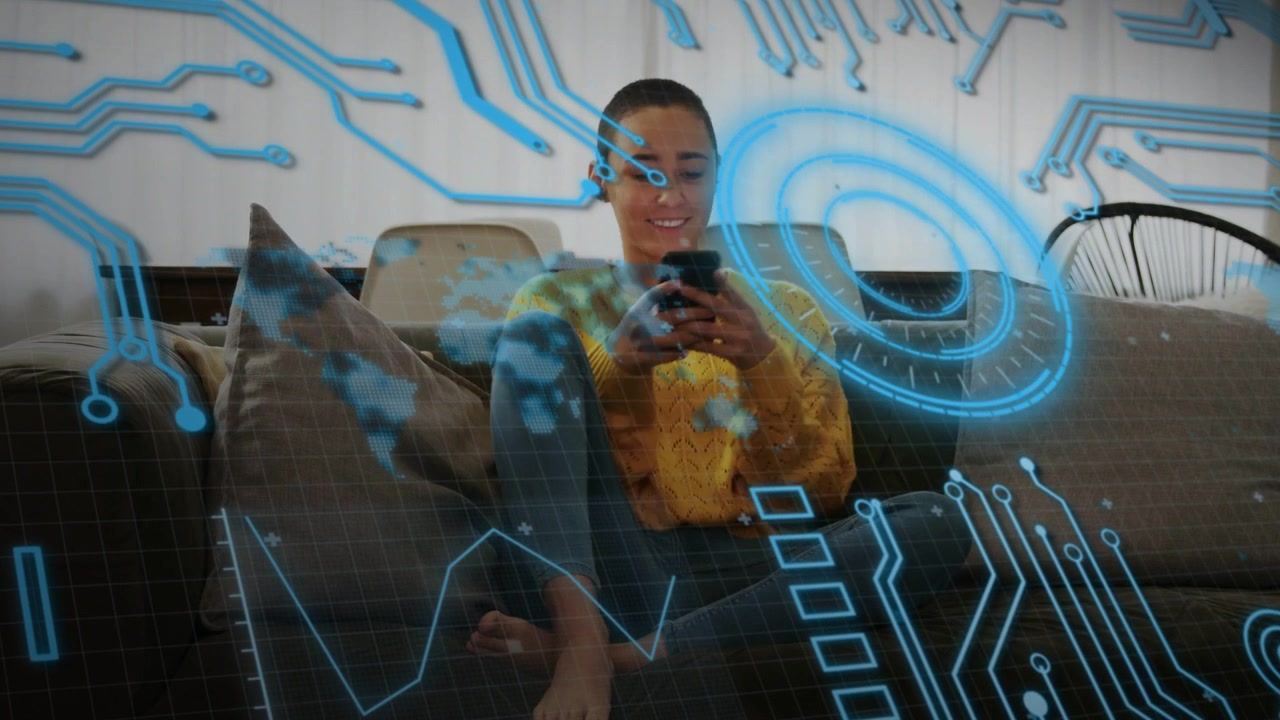 Woman sitting cross-legged on sofa tapping phone and activating tech HUD graphics showing data