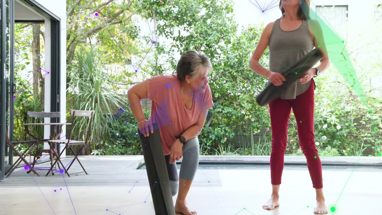 Two women nodding and unrolling mats on patio, preparing while AR overlay highlighting fitness mats