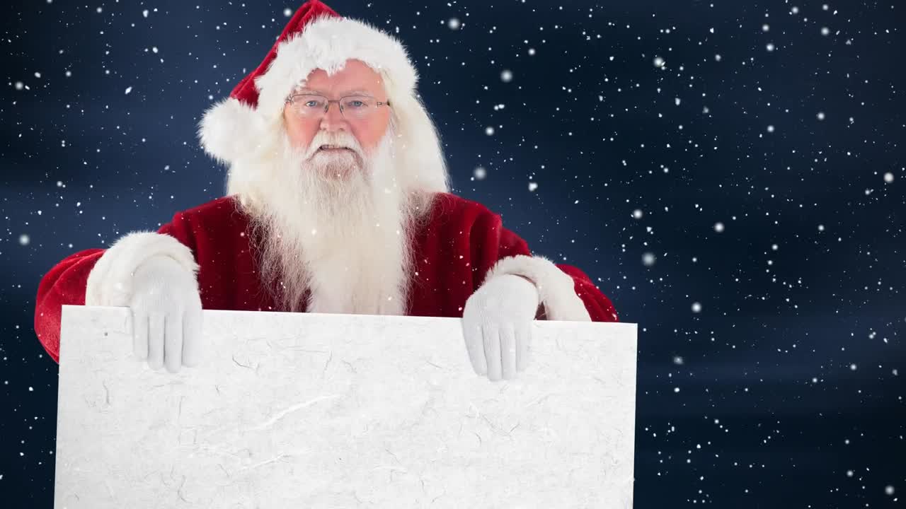 santa claus sosteniendo un cartel combinado con la nieve que cae