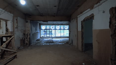 walking by the old shabby premise with no doors inside. reconstruction process of a building.